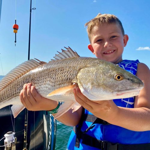 Ultimateoutdoorstv_KidHoldingRedFish_BringTheWholeFamily
